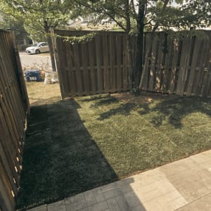 An uneven, aging patio and lack of healthy grass made this backyard difficult to enjoy. After receiving property management’s approval to remove interfering tree roots, our team leveled the area and installed a new patio along with fresh sod. The transformation resulted in a balanced, functional outdoor space ready for everyday use. Project 17 Complete Backyard Makeover